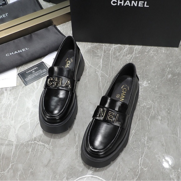 CHANEL Black Leather Loafers with Gold Accents - Picture 2 of 9